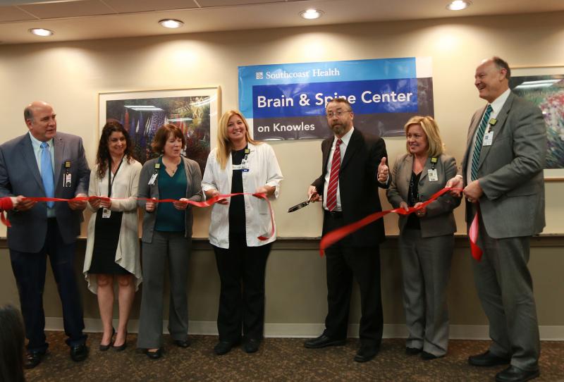 Southcoast Health staff cut the ribbon for the newly dedicated area for brain and spine patients at St. Luke’s Hospital in New Bedford on Thursday, Nov. 30. Pictured (from left) are Dr. Ray Kruger, Physician-in-Chief of Surgery; Maria Couto, Southcoast Brain & Spine Center Office Manager; Tonya Johnson, Associate Chief Nursing Officer at St. Luke’s Hospital; Melissa Kochan, Nurse Manager for Knowles at St. Luke’s Hospital; Dr. Matthew Philips, Medical Director of the Brain & Spine Center; Renee Clark, Chief Operating Officer for Southcoast Health; and Tim Eixenberger, Chief Nursing Officer for Southcoast Health.